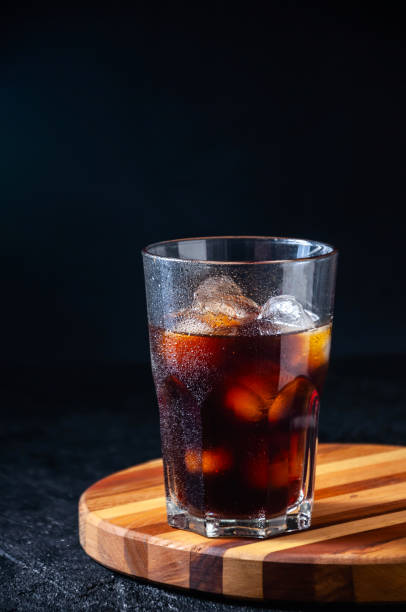istock Iced Cola or Cold Coffee in Tall Glass on Dark Background. Concept Refreshing Summer Drink 1210960598