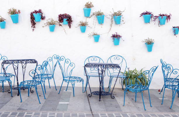 istock flower pots on the wall in spain 1210964347