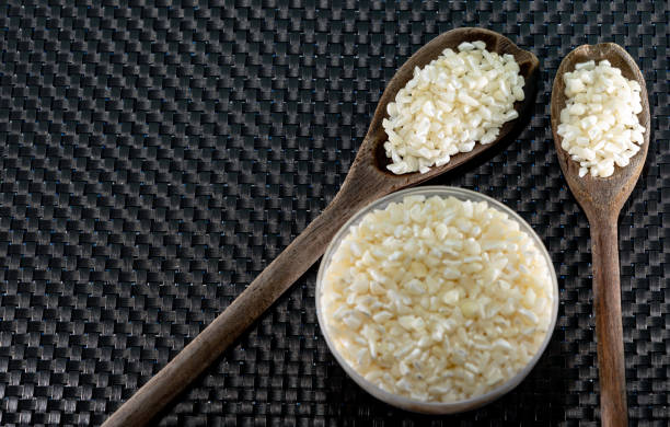 istock . White corn served in bowl and wooden spoons 1210966463