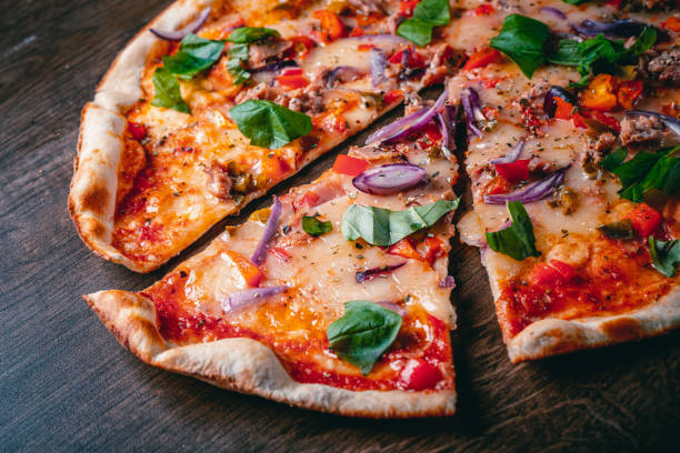 pizza with mozzarella cheese, onion, tuna fish, tomato sauce, pepper, basil. italian pizza on wooden table background - pizza tuna prepared fish cheese imagens e fotografias de stock