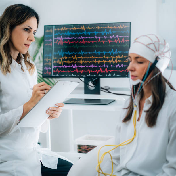 istock Female Patient in a Neurology Lab doing EEG Scan 1210966979