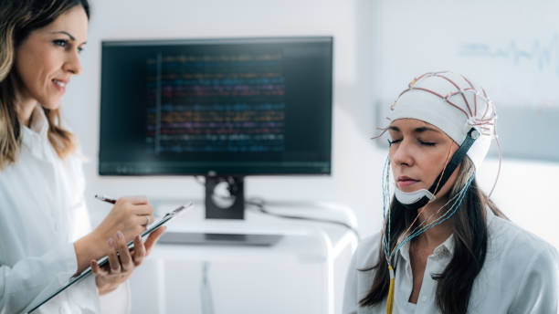 istock Doctor and Patient in Neuroscience Lab, Doing EEG Scan 1210967159