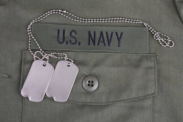 istock U.S. Navy Branch Tape with dog tags on olive green uniform 1210970376