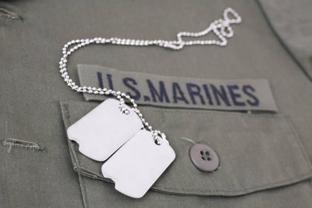 istock U.S. MARINES Tape with dog tags on olive green uniform 1210970399