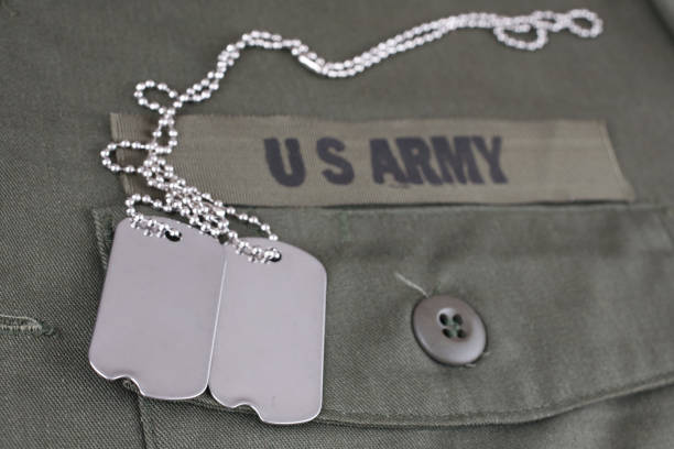 istock U.S. Army Branch Tape with dog tags on olive green uniform 1210970446