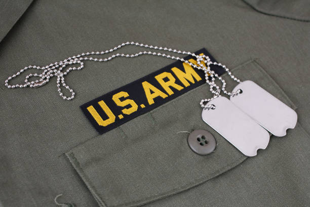 istock U.S. Army Branch Tape with dog tags on olive green uniform 1210970498