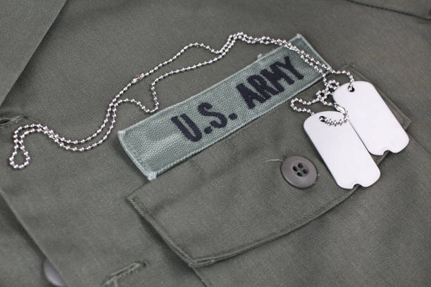 istock U.S. Army Branch Tape with dog tags on olive green uniform 1210970523