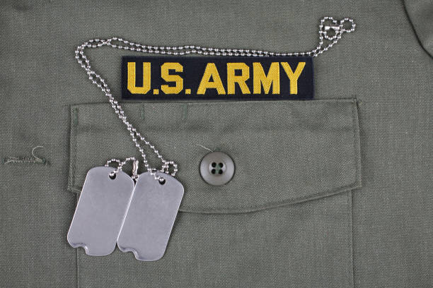istock U.S. Army Branch Tape with dog tags on olive green uniform 1210970793