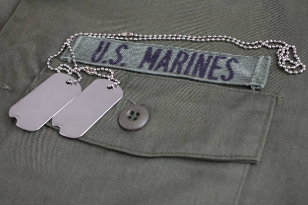 istock U.S. MARINES Tape with dog tags on olive green uniform 1210970830