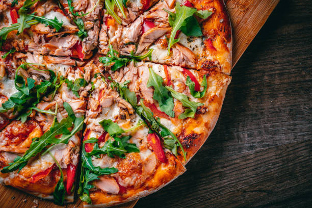 pizza with mozzarella cheese, salmon fish, tomato sauce, pepper. italian pizza on wooden table background - pizza tuna prepared fish cheese imagens e fotografias de stock