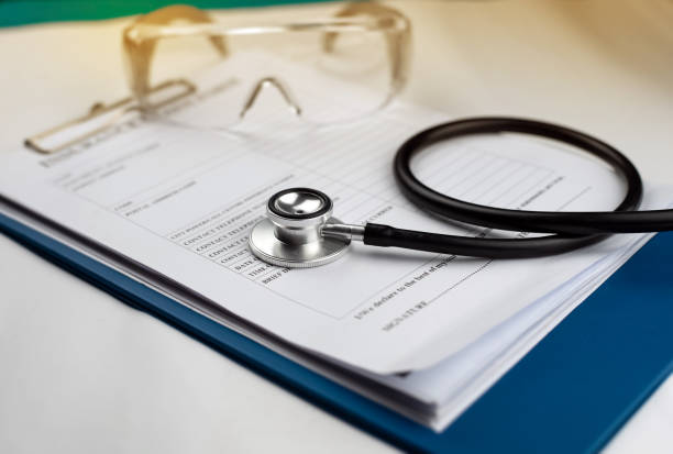 istock The stethoscope put on insurance claim form,blurry light around 1210971995