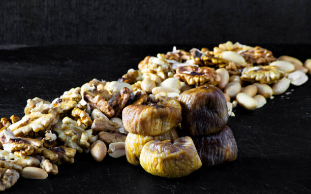 istock dried figs and dried fruit with peanuts and walnuts 1210972072