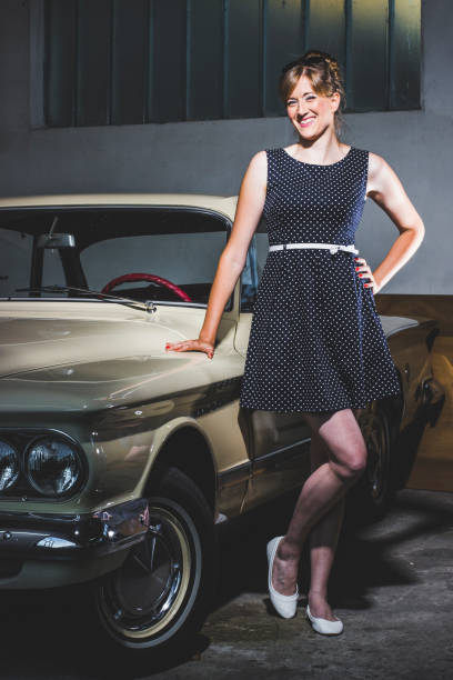 istock Pin up lady and her vintage car 1210972131