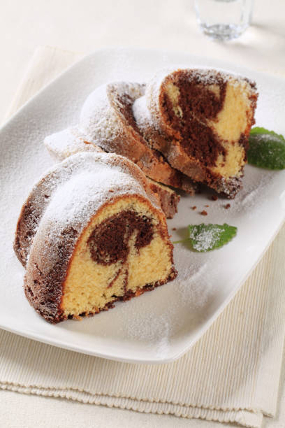 istock Slices of marble cake sprinkled with icing sugar 121097692