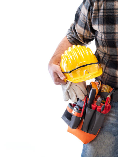 istock Electrician with tool belt on a white background. Electricity. 1210979914