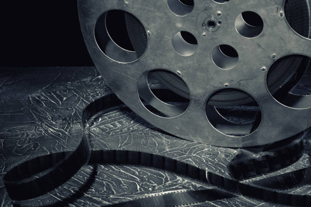 istock 35 mm film reel with dramatic lighting on a dark background 1210980226