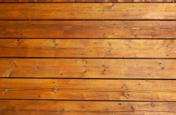 istock Stained wet deck wooden boards with water drops, brown planks texture 1210980453
