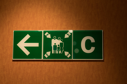 Green emergency exit sign in Cruise ship