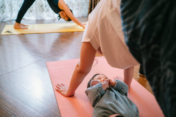 istock Mother doing yoga with her baby 1210982057