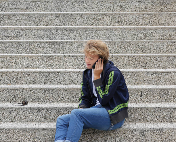 istock Teenage boy typing text message.Using smart phone. 1210982307