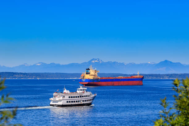 Seattle, WA, USA - JULY 22:  Ships on Elliot Bay with Olympus Mountains in Seattle on July 22, 2018 in Seattle, Washington.