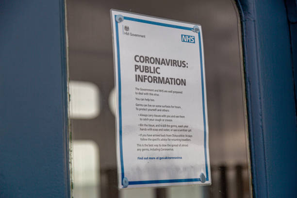 Coronavirus Public Information Poster UK Public information poster from the NHS (National Health Service) with advice relating to the COVID-19 Coronavirus medium shot stock pictures, royalty-free photos & images