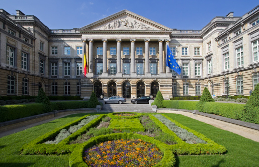 The Belgian parliament in Brussels, Belgium, with the Belgian and the European Union flag