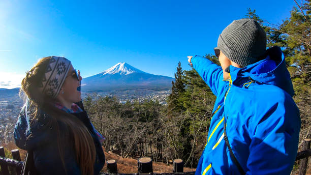 istock Japan - A couple pointing at Mt Fuji 1210987459