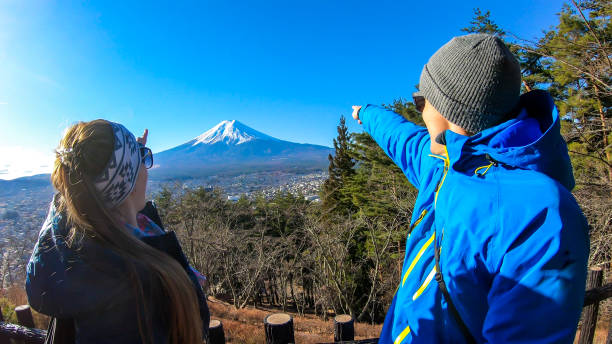 istock Japan - A couple pointing at Mt Fuji 1210987616