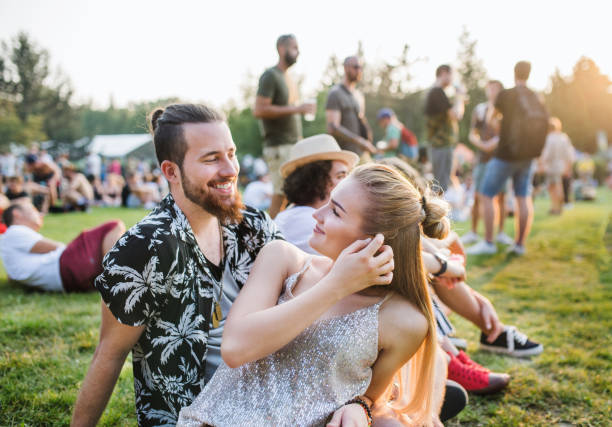 istock A young couple at summer festival, talking. 1210988391