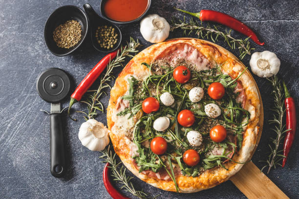 istock Chili pizza, spice and pizza cutter 1210991328
