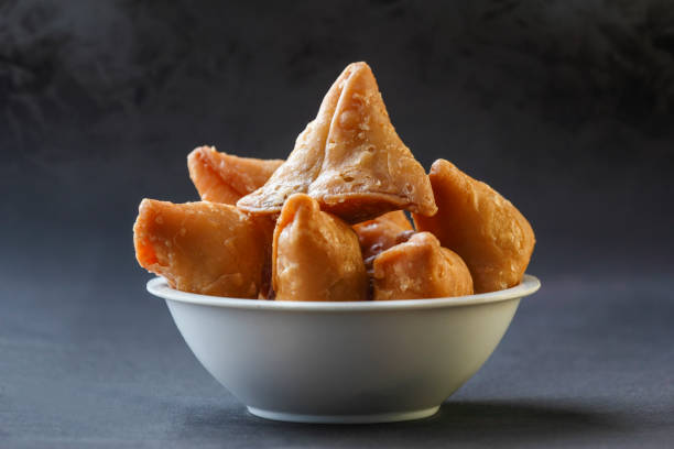 istock Gujiya  Samosa an Indian Holi special snacks 1210992018