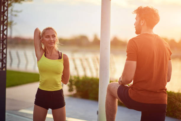 istock Modern couple doing exercise in urban area. 1210992059