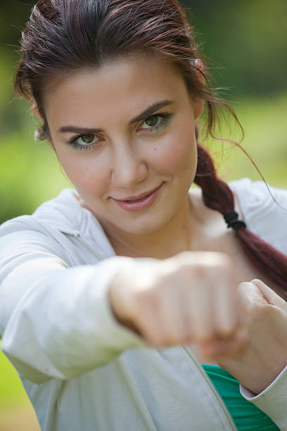 istock fitness woman punching 121099358