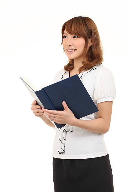 istock Young asian business woman holding a book 121099384