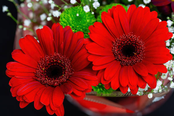 The pink bouquet on the table.