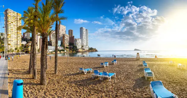 Photo of anoramic seascape view of summer resort with beach(Playa de Llevant) and famous skyscrapers. Costa Blanca. City of Benidorm, Alicante, Valencia, Spain.