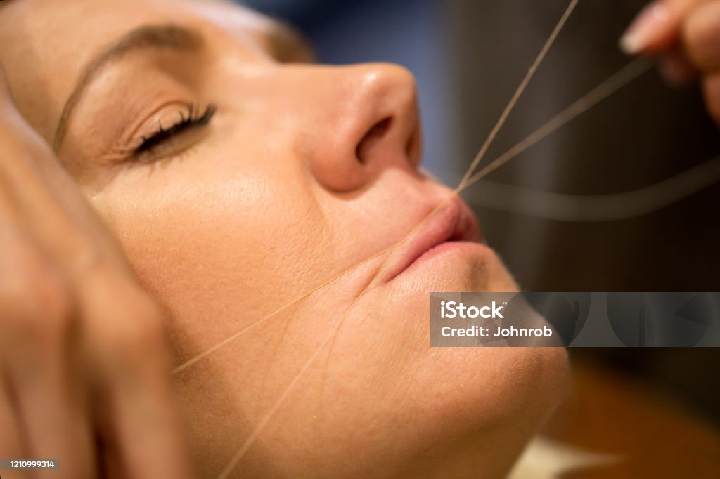 Lip Threading In Action Hair Removal Of Upper Lip Close Up Stock Photo -  Download Image Now - iStock