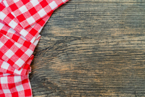 istock Red checkered towel on the kitchen table. 1211001770