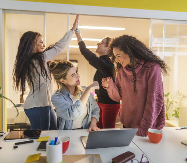 istock New business startup: all women team work together in coworking office 1211004846