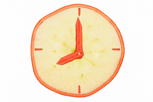 istock Apple and carrot clock face collage on white background. 1211007175