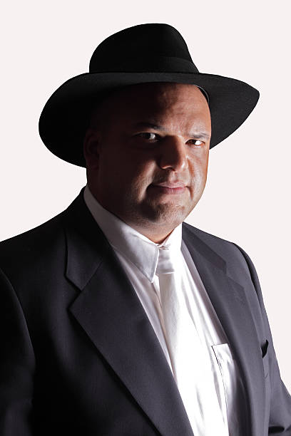 istock Black man wearing a suit, tie and hat 121100899