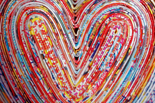 сердца - abstract newspaper macro heart shape стоковые фото и изображения
