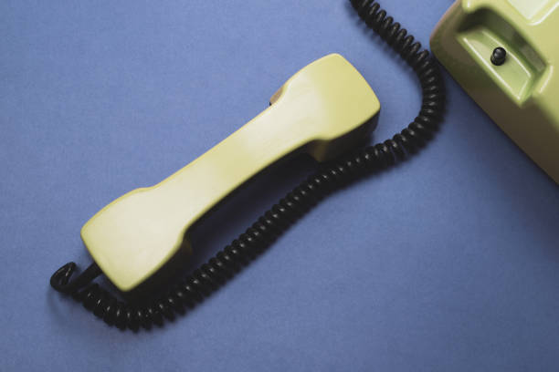 istock Vintage telephone handset. phone receiver on blue background. old communication technology. copy space 1211013114