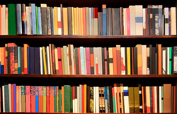 New books - bookshelves stock photo