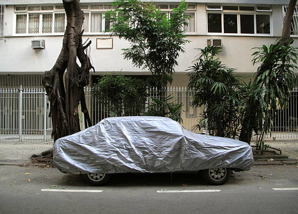 istock Car parked on the street covered 121101400