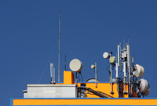 Different communication antennas located at the top of a building