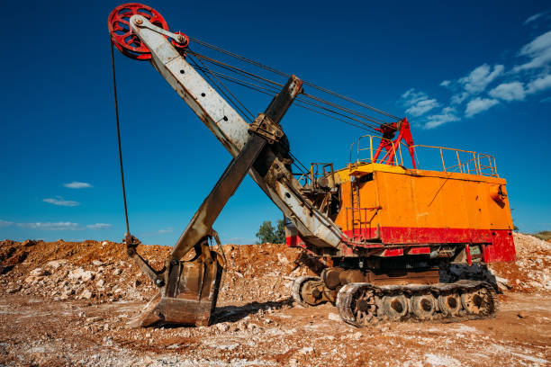 istock Excavator machine works in limestone pit quarry 1211017099