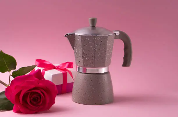 Photo of Present a traditional Italian coffee maker and a rose pink floyd color