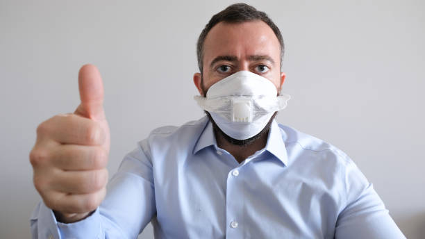 istock Young Adult Wearing Mask For Disease 1211021407